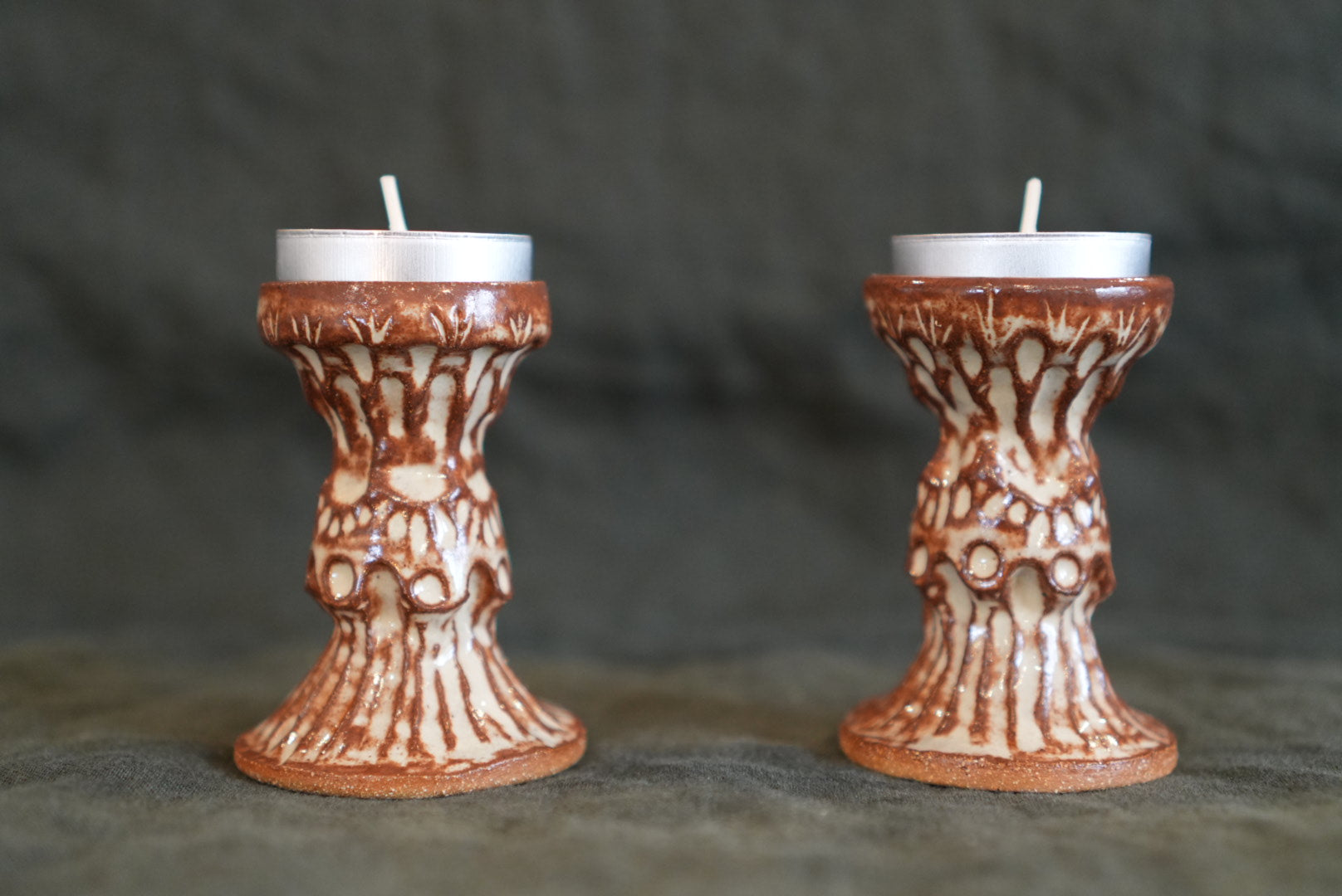 Brown and White Carved Candlesticks